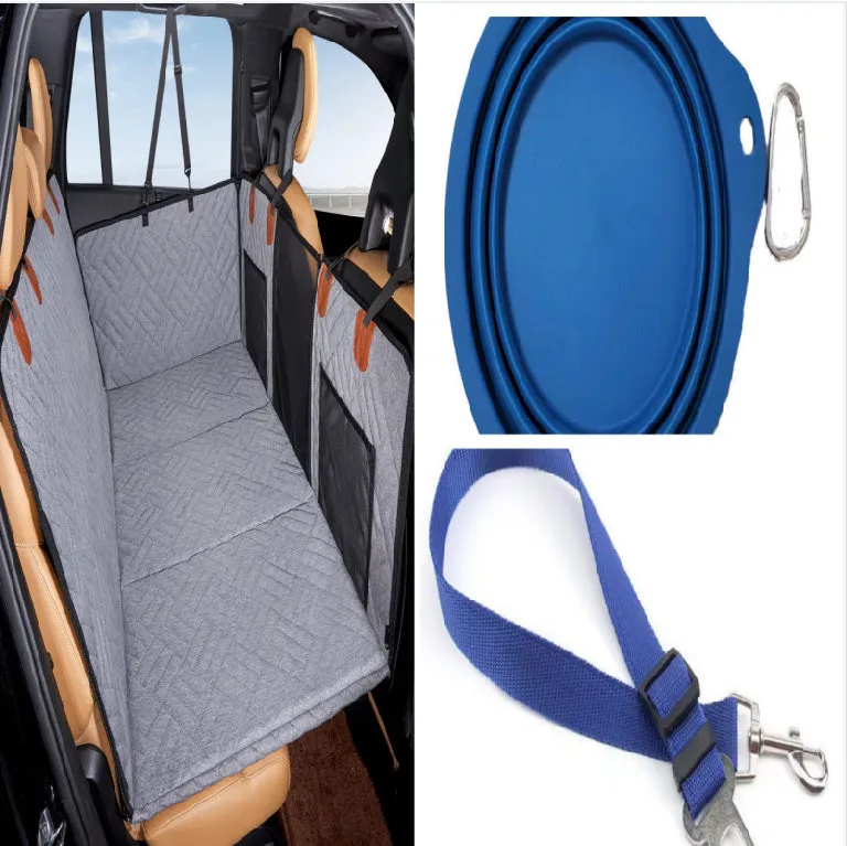 Black waterproof car dog bed cushion on rear seats protecting against pet mess