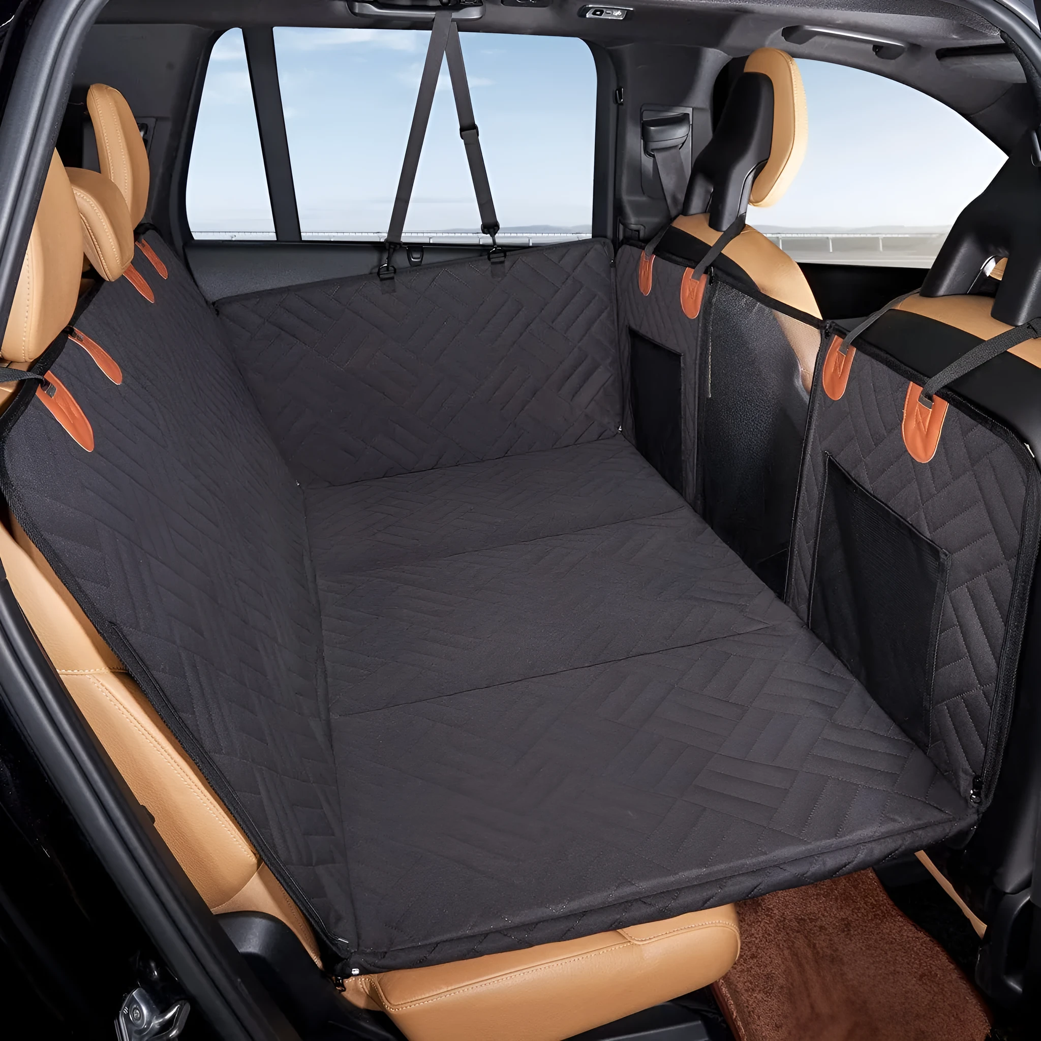 Black waterproof car dog bed cushion on rear seats protecting against pet mess