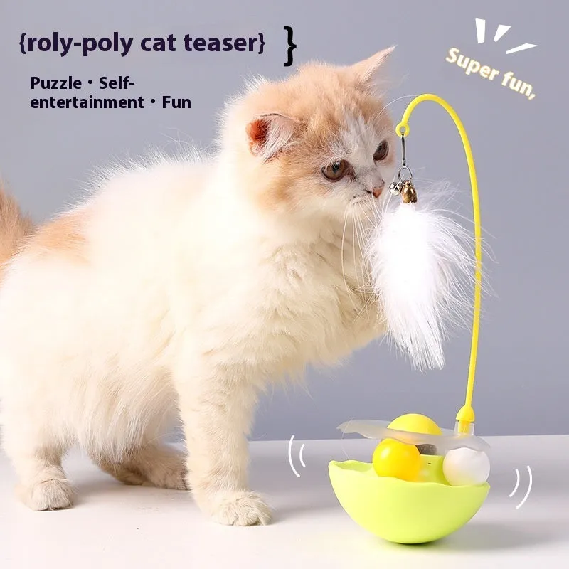 Cat interactive tumbler toy with feather wand and catnip ball on floor for kitten exercise