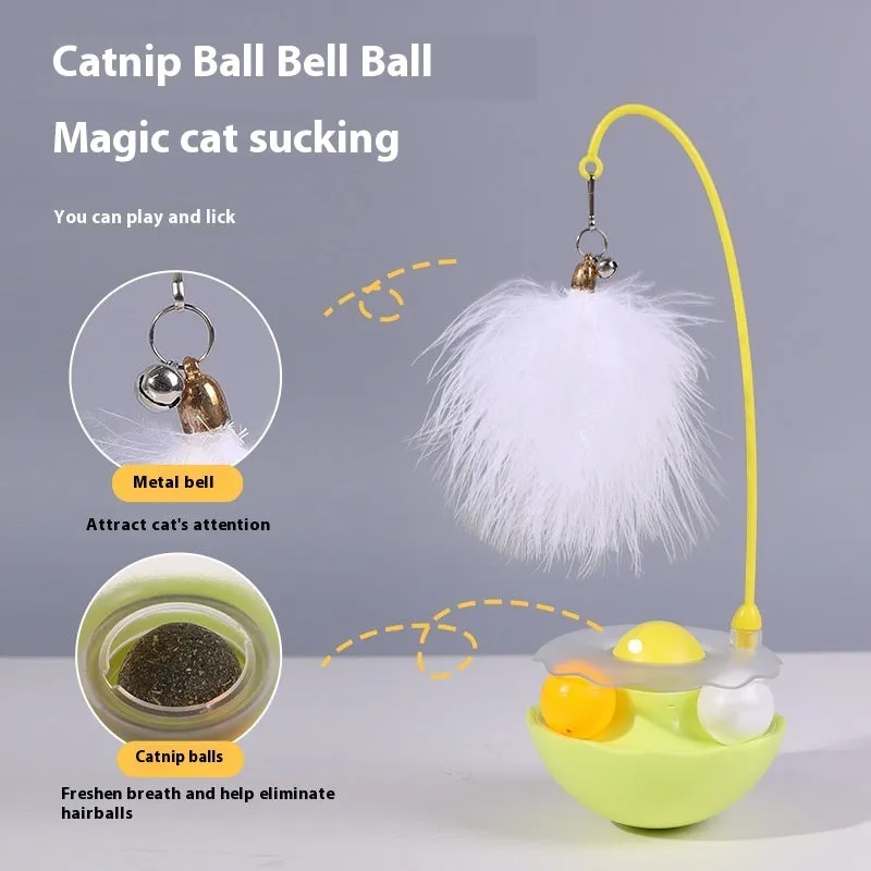 Cat interactive tumbler toy with feather wand and catnip ball on floor for kitten exercise