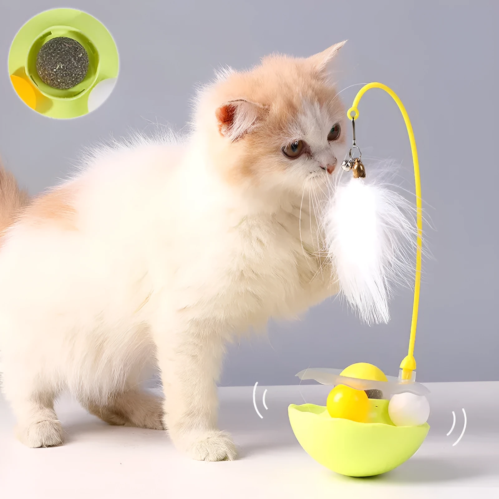 Cat interactive tumbler toy with feather wand and catnip ball on floor for kitten exercise