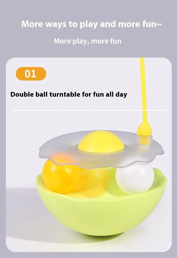 Cat interactive tumbler toy with feather wand and catnip ball on floor for kitten exercise