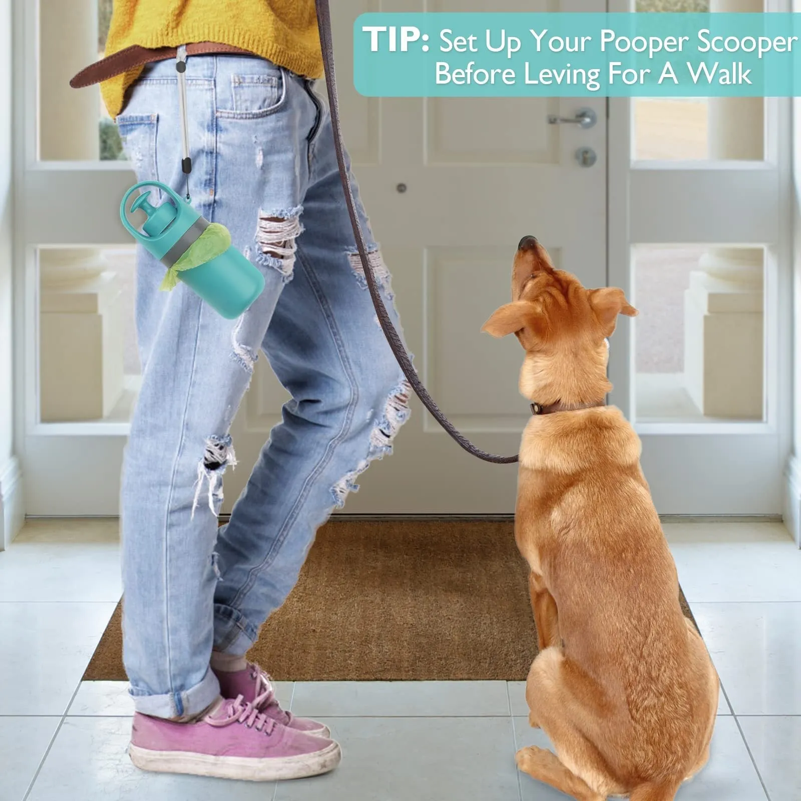 Blue portable dog poop scooper with built-in bag dispenser, clipped to a dog leash