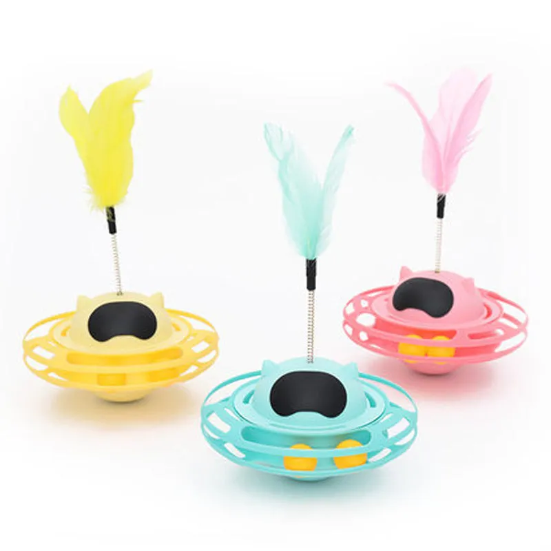 Pink cat tumbler turntable toy on a floor for feline self-play