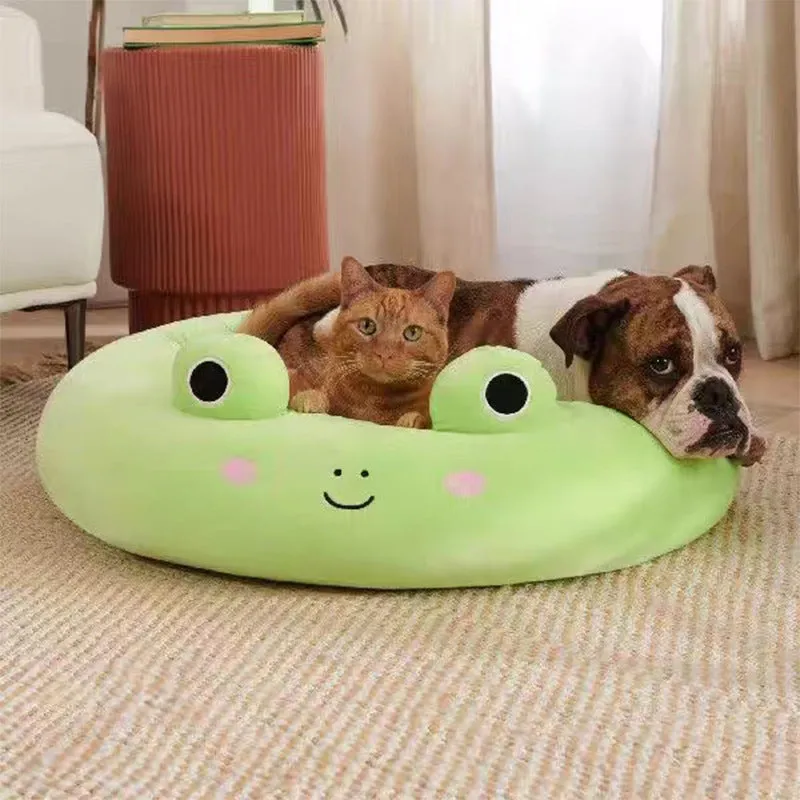 Large Squishmallows plush pet bed in green with bolster edges and non-skid bottom on floor