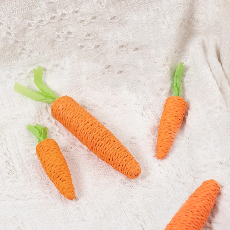 Set of four different cat toys including paper crinkle toys, ringing stones, textured sticks, and tooth grinding sticks