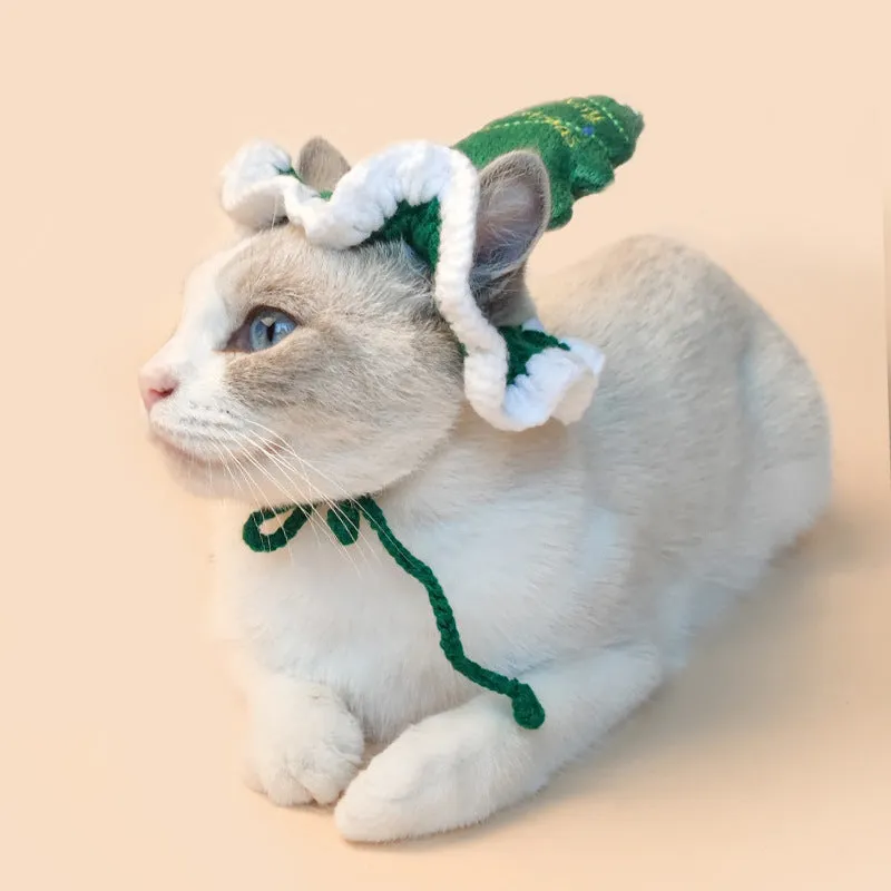 Hand crocheted monochrome Christmas tree pet hat with rope tie on a cat