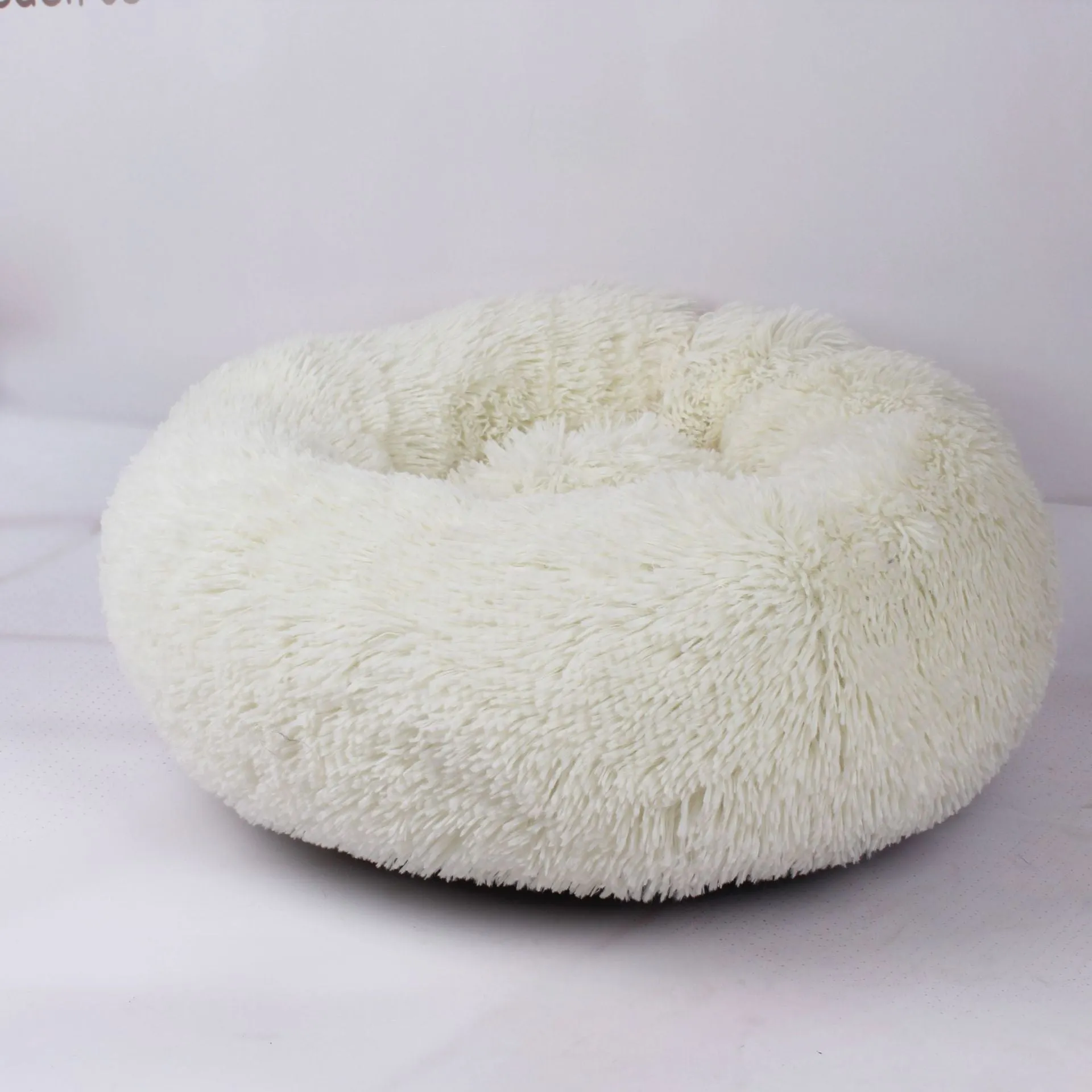 Round plush pet bed 110cm diameter in soft vegan fur fabric, available in multiple colours for small dogs and cats