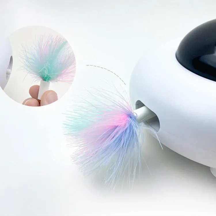UFO electric cat toy with vibration activation, showing UFO body, feathers, and cleaning rings on a surface
