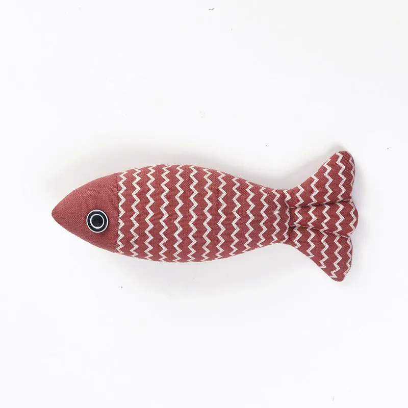 Set of three linen fish cat biting toys in navy blue, red, and yellow. Each measures 21x9x5cm.
