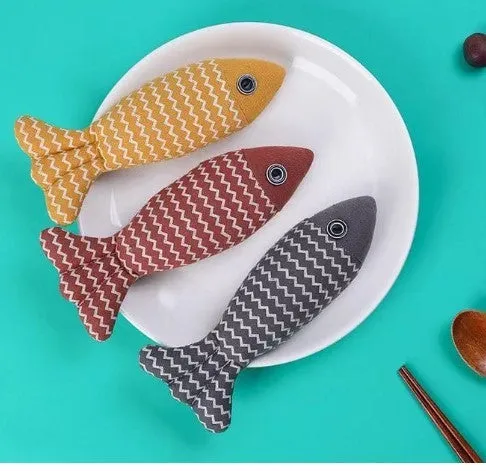 Set of three linen fish cat biting toys in navy blue, red, and yellow. Each measures 21x9x5cm.