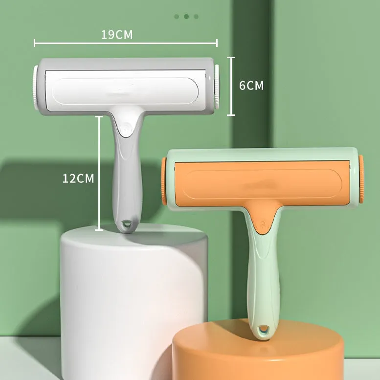 Pet hair remover roller brush with automatic cleaning, 19x18cm, in green orange, on a sofa surface.