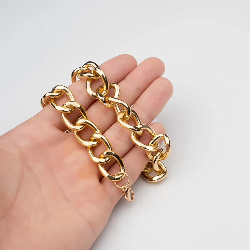 Gold metal pet necklace with extension chain on a cat or dog