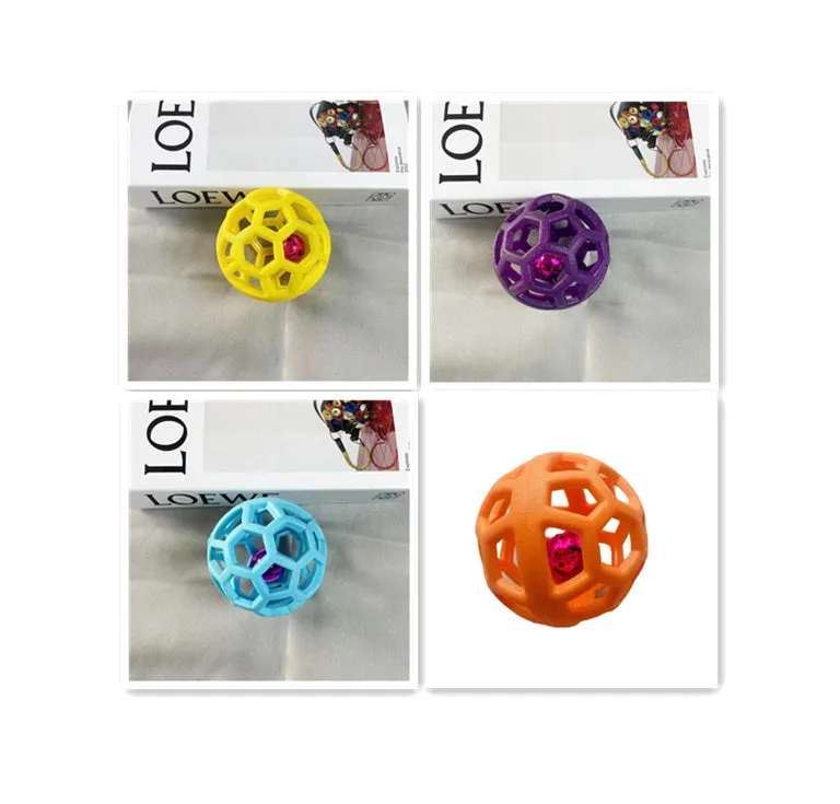 Orange TPR dog chew ball toy 9cm diameter with bell on white background