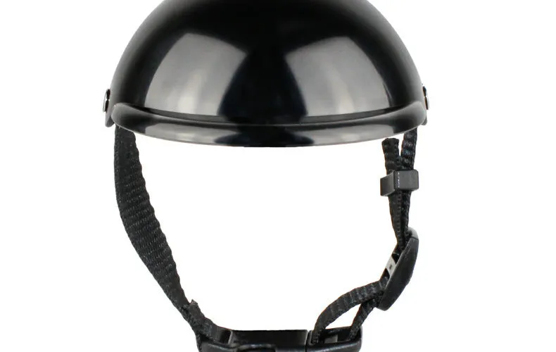 Black pet motorcycle helmet for dog or cat with adjustable strap on a bicycle