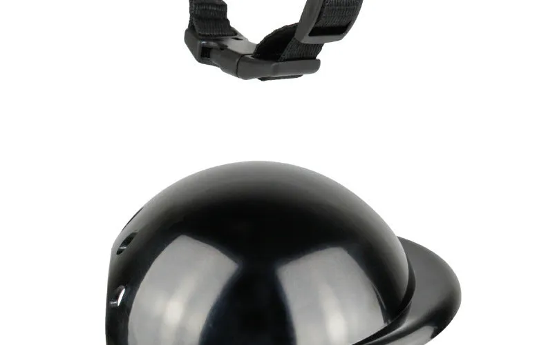 Black pet motorcycle helmet for dog or cat with adjustable strap on a bicycle