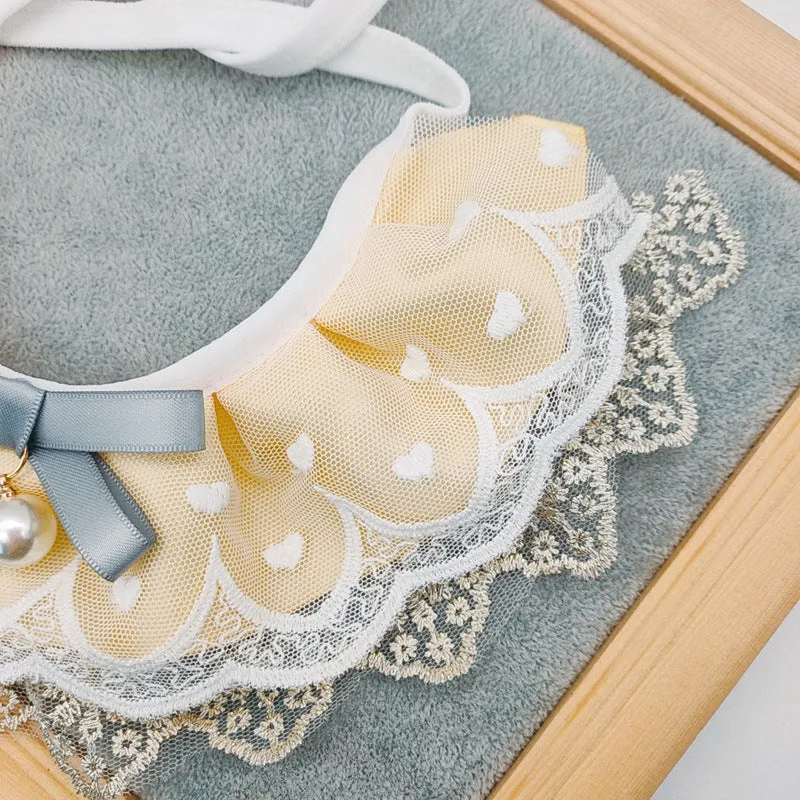 Yellow cat cotton bib with lace trim, princess style, on a white background showing front view with adjustable side lacing