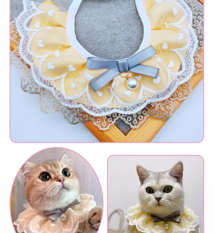 Yellow cat cotton bib with lace trim, princess style, on a white background showing front view with adjustable side lacing
