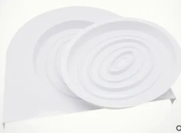 Blue cat toilet trainer with grooved removable trays placed on a white toilet seat
