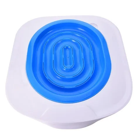 Blue cat toilet trainer with grooved removable trays placed on a white toilet seat