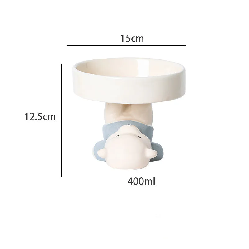 Raised ceramic pet bowl in animal design, showing wide shallow dish on elevated base.