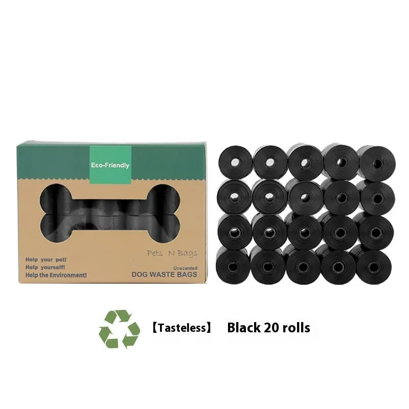 A roll of green EPI degradable pet waste bags next to a black dispenser on a grass background.