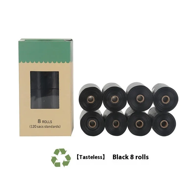 A roll of green EPI degradable pet waste bags next to a black dispenser on a grass background.