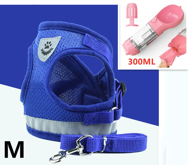 Blue breathable mesh dog harness with reflective belt for small and medium dogs, showing hook and loop closure and metal carabiner