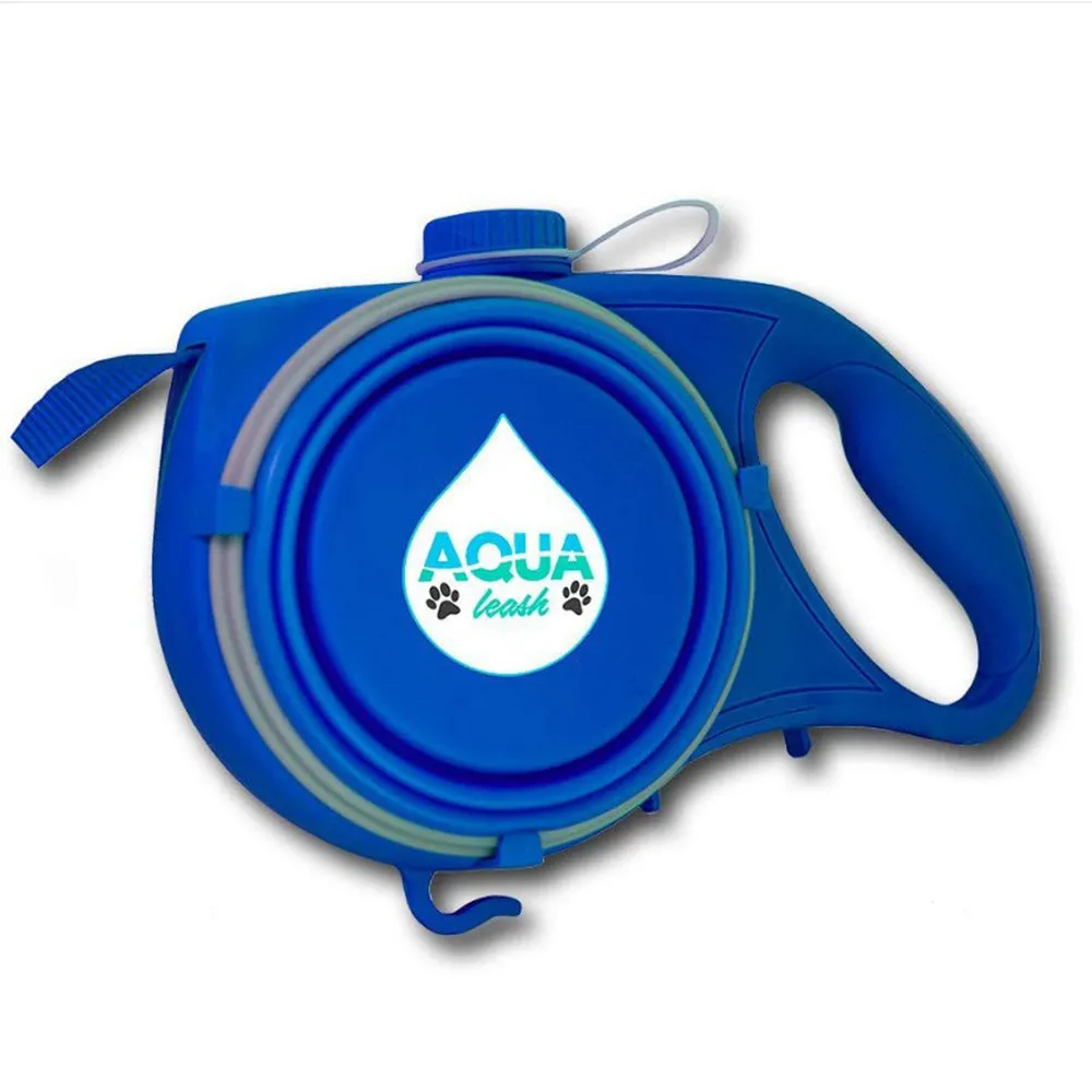 Blue retractable dog leash with ergonomic handle and silicone folding bowl on grass
