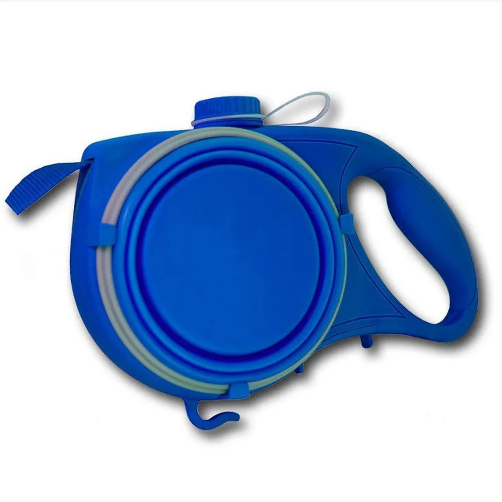 Blue retractable dog leash with ergonomic handle and silicone folding bowl on grass