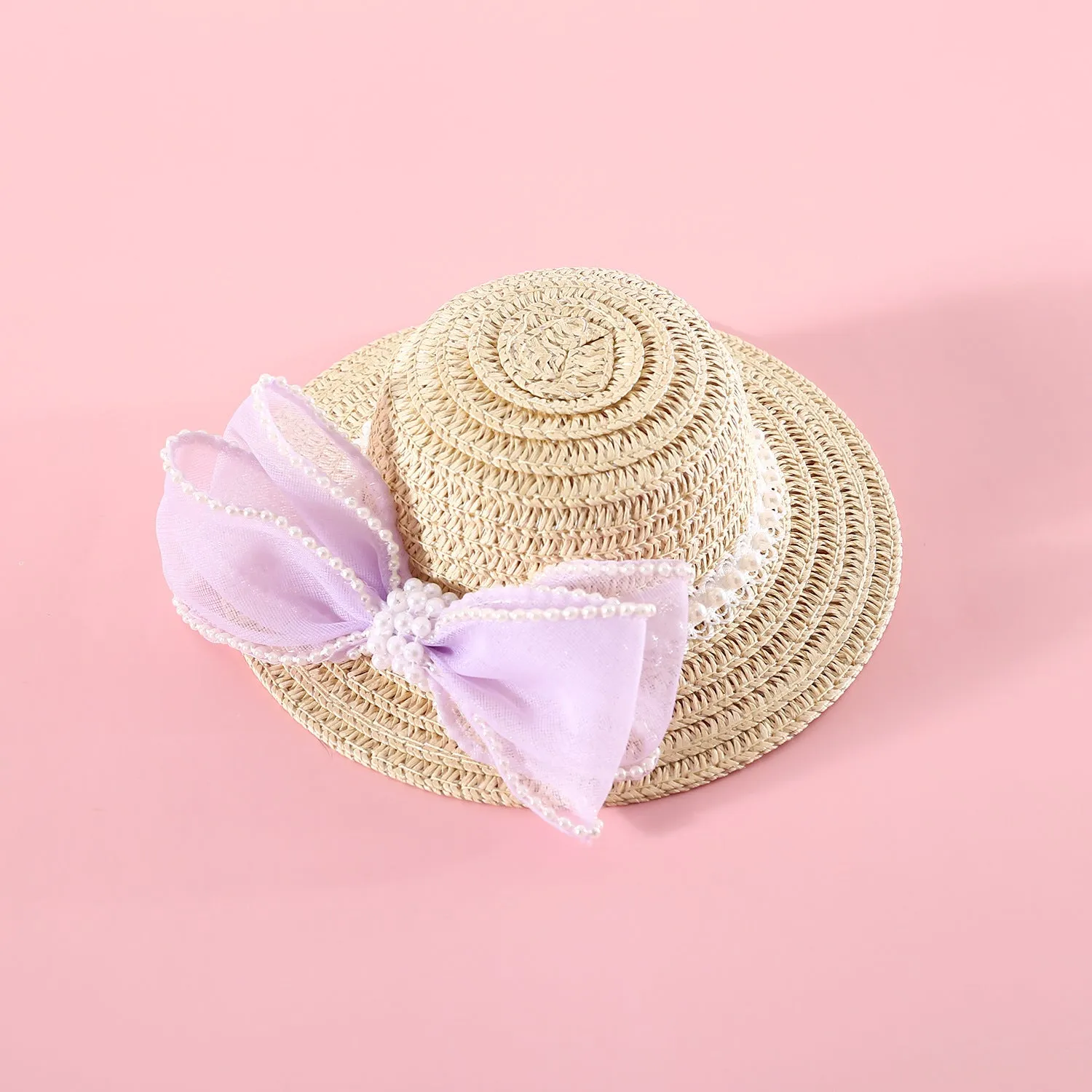 Woven straw cat hat with a pearl bow, shown in blue, pink, purple, and white colour options