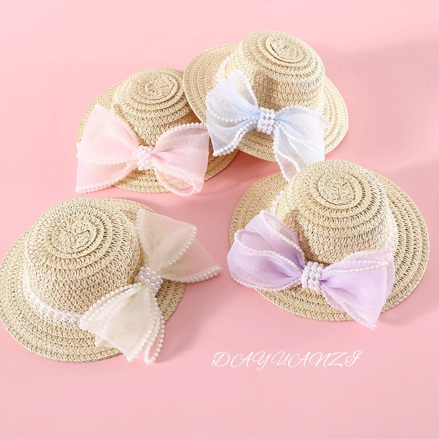 Woven straw cat hat with a pearl bow, shown in blue, pink, purple, and white colour options