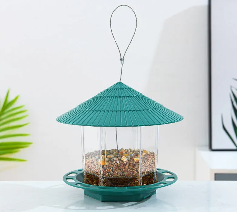 Green PP hanging transparent bird feeder with automatic feeding for outdoor garden use