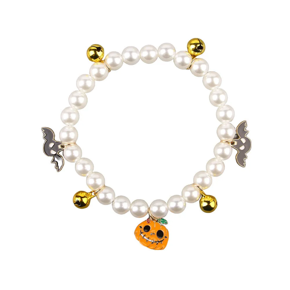 Halloween pet collar with simulated pearls and a purple ghost pumpkin charm around a cat's neck.