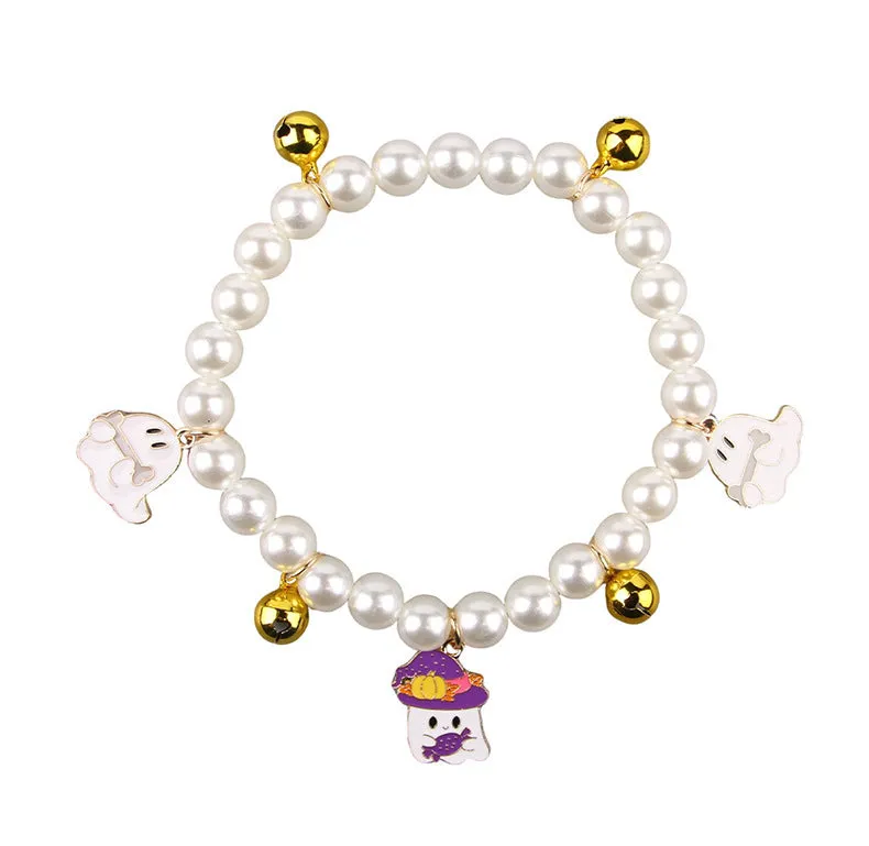 Halloween pet collar with simulated pearls and a purple ghost pumpkin charm around a cat's neck.