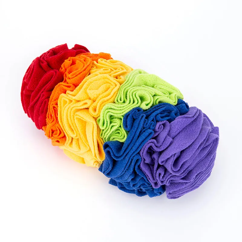 Dog snuffle pad made of polar fleece fabric in rainbow colour, 25x15cm, lying flat on floor