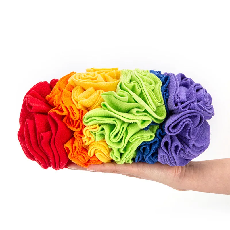Dog snuffle pad made of polar fleece fabric in rainbow colour, 25x15cm, lying flat on floor
