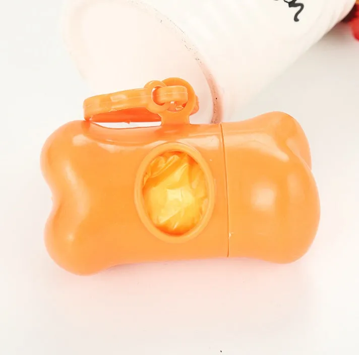 Bone-shaped pet garbage bag dispenser in new PP material, 8cm long and 5cm wide, on a table