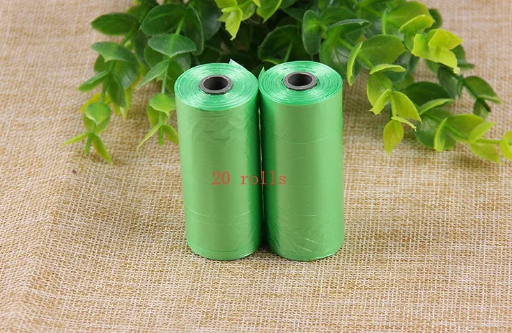 Bone-shaped pet garbage bag dispenser in new PP material, 8cm long and 5cm wide, on a table
