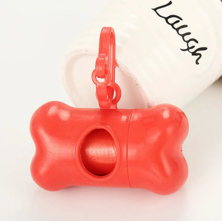 Bone-shaped pet garbage bag dispenser in new PP material, 8cm long and 5cm wide, on a table