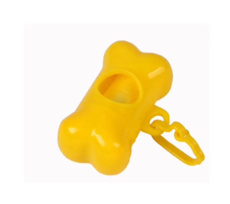 Bone-shaped pet garbage bag dispenser in new PP material, 8cm long and 5cm wide, on a table