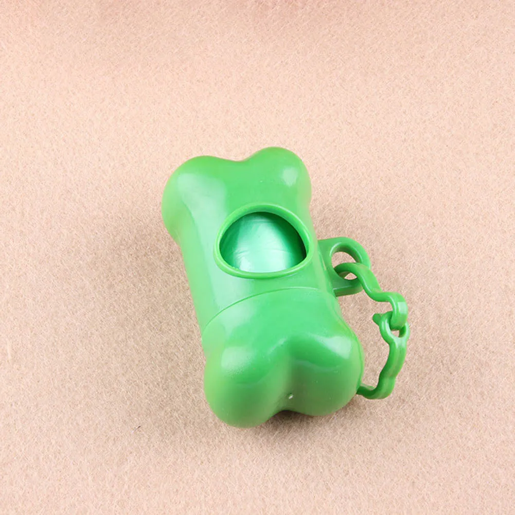 Bone-shaped pet garbage bag dispenser in new PP material, 8cm long and 5cm wide, on a table