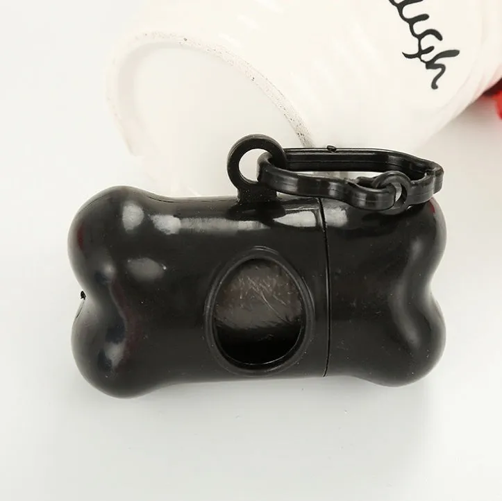 Bone-shaped pet garbage bag dispenser in new PP material, 8cm long and 5cm wide, on a table