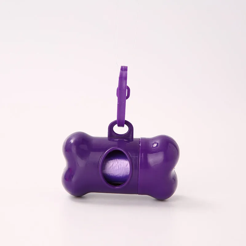 Bone-shaped pet garbage bag dispenser in new PP material, 8cm long and 5cm wide, on a table