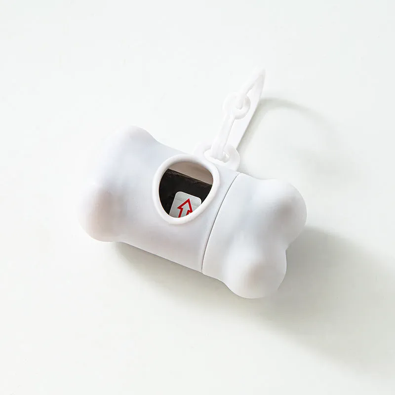 Bone-shaped pet garbage bag dispenser in new PP material, 8cm long and 5cm wide, on a table