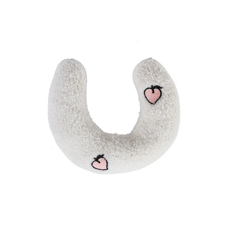 Soft quilted U-shaped cat pillow in blue, 26x18cm, on a clean white background