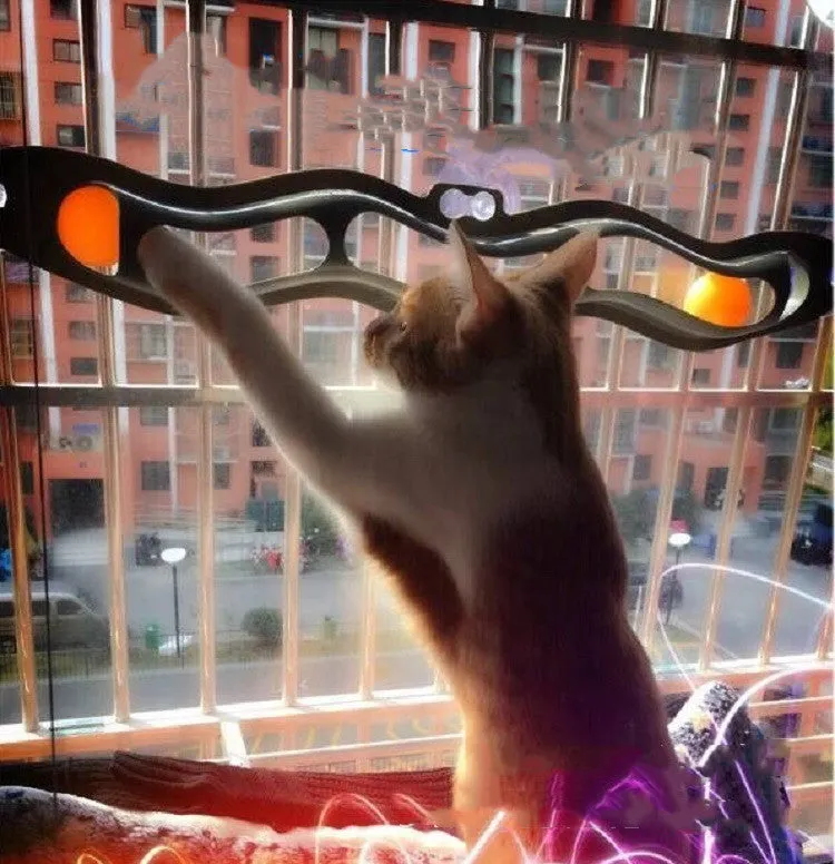 Grey plastic cat climbing frame with track ball toy on a windowsill, approximately 57cm long and 10cm wide