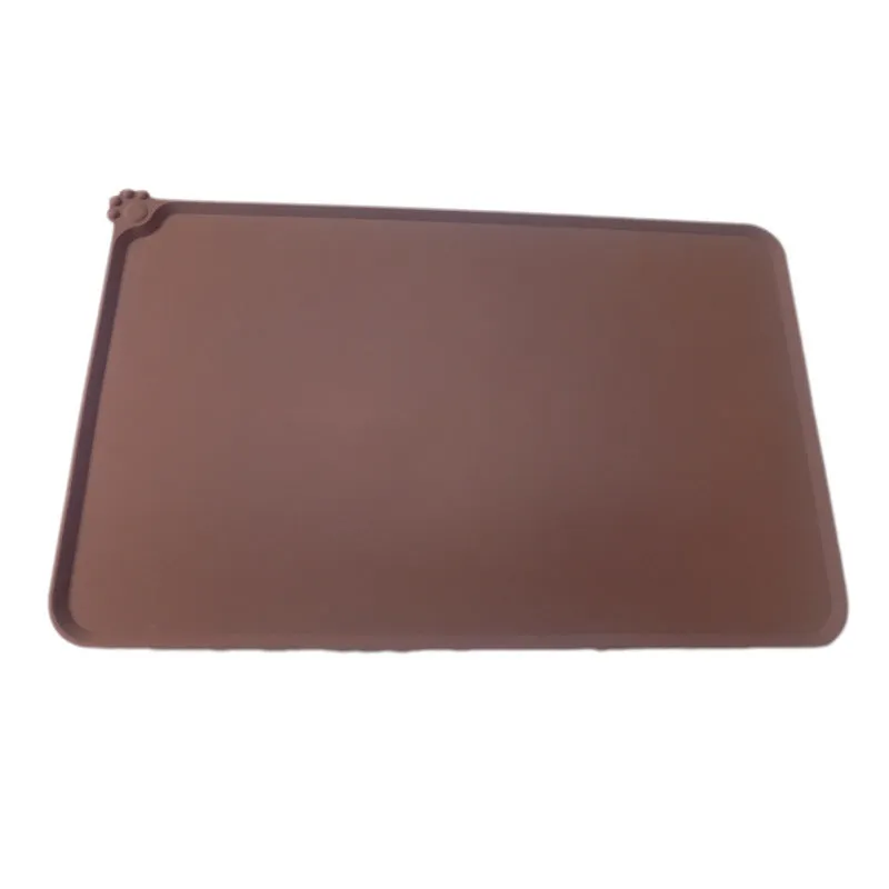 Grey waterproof silicone pet mat with raised edges and a non-slip base, measuring 47x29.5cm, placed under two pet bowls