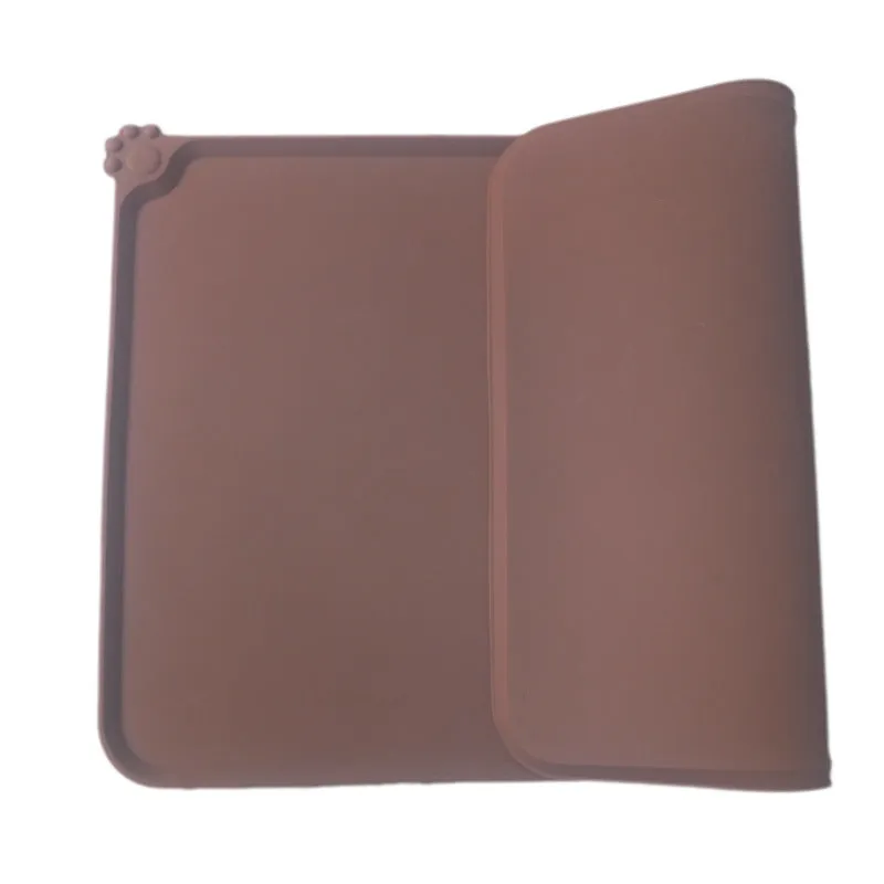 Grey waterproof silicone pet mat with raised edges and a non-slip base, measuring 47x29.5cm, placed under two pet bowls