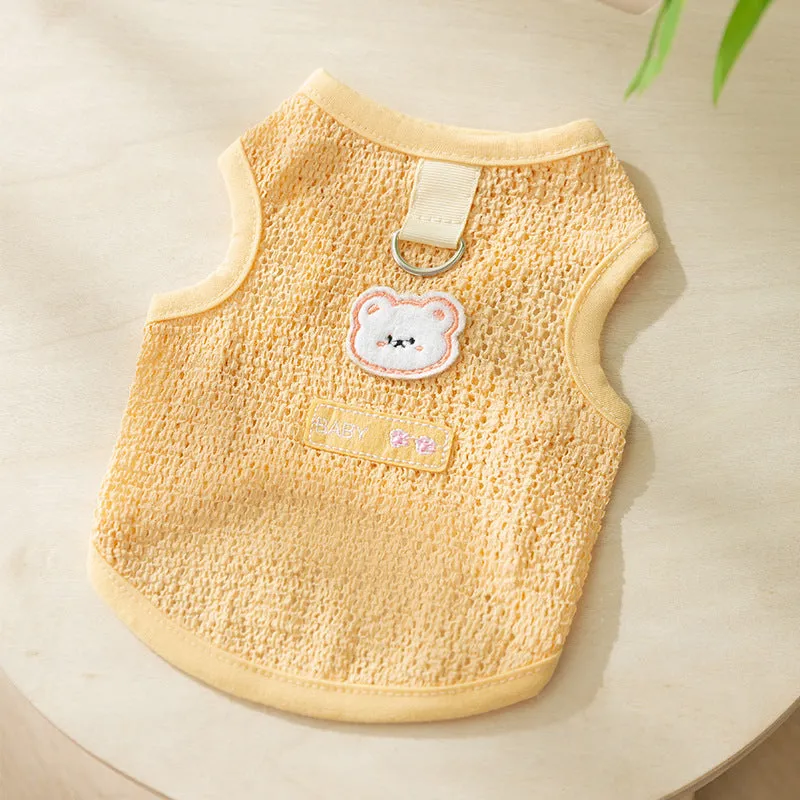 Cat wearing green bear patch cartoon clothing with hollowed-out breathable design
